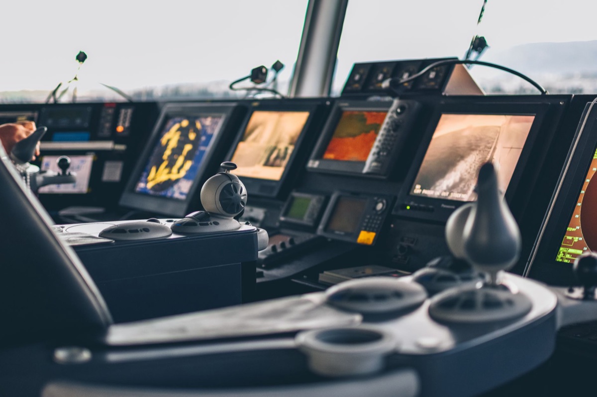 Command center with flight paths and commanders over maps